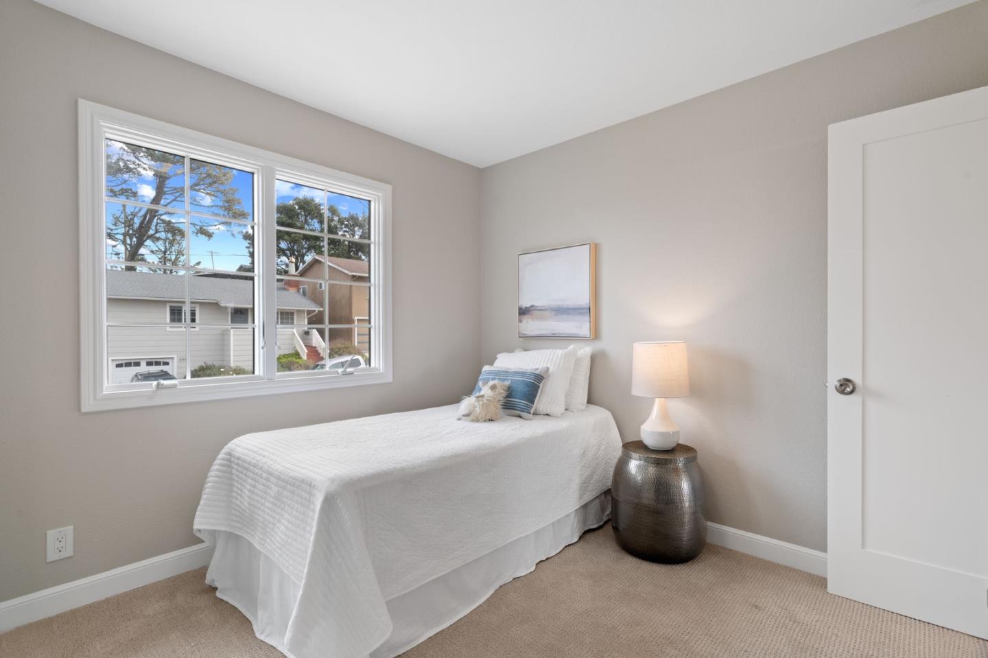 3901 Coronado Way San Bruno, CA 94066 - Photo 17 of 31 a bedroom with a bed and a large window