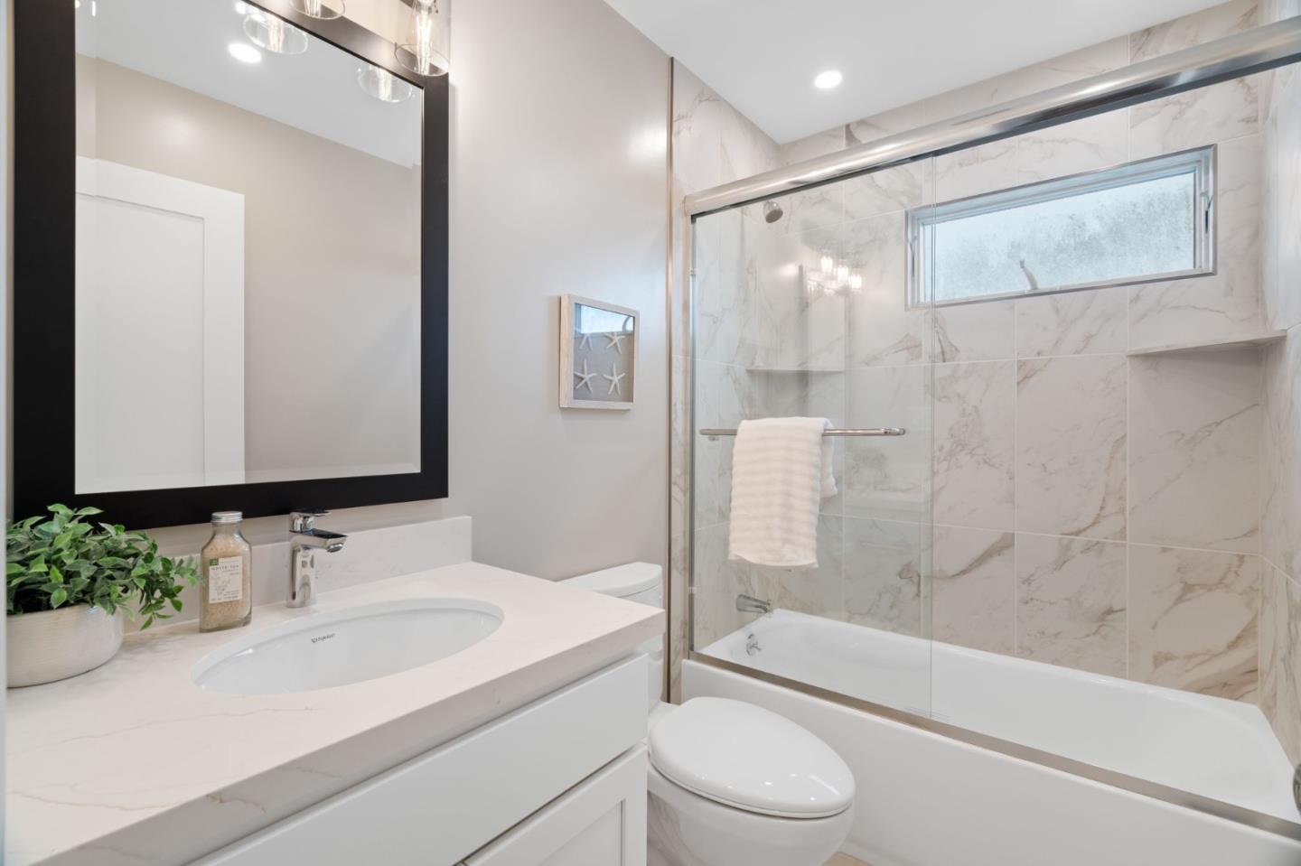 3901 Coronado Way San Bruno, CA 94066 - Photo 18 of 31 a bathroom with a granite countertop sink toilet and shower