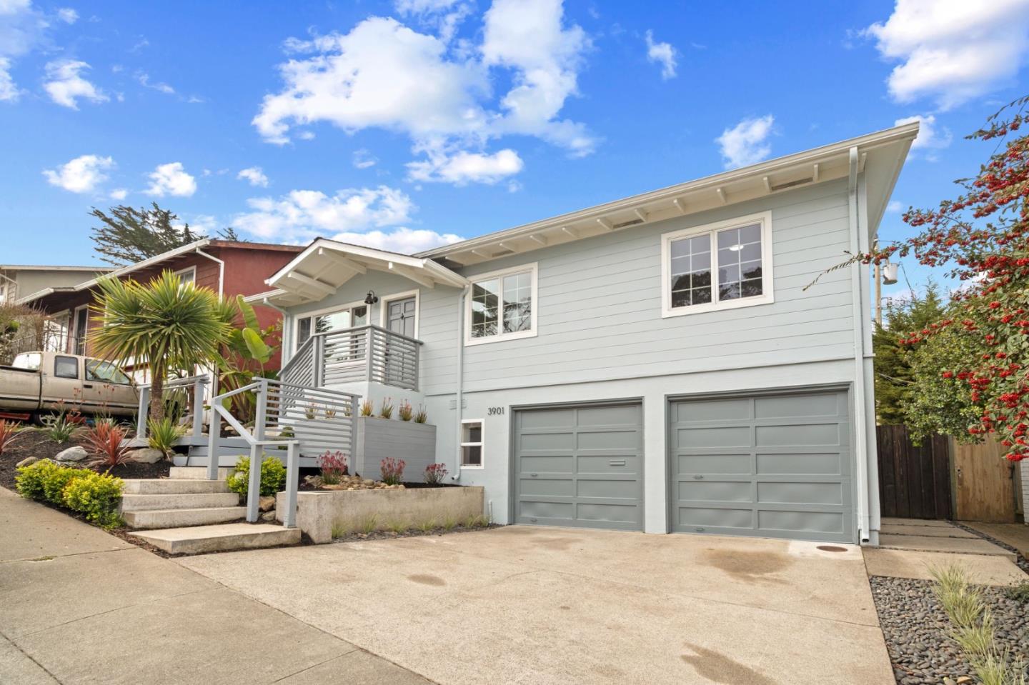 3901 Coronado Way San Bruno, CA 94066 - Photo 2 of 31 a front view of a house with a yard and garage
