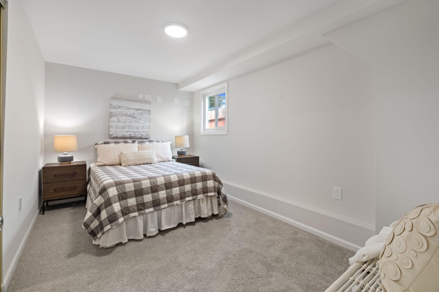 3901 Coronado Way San Bruno, CA 94066 - Photo 26 of 31 a bedroom with a bed and a lamp with the table