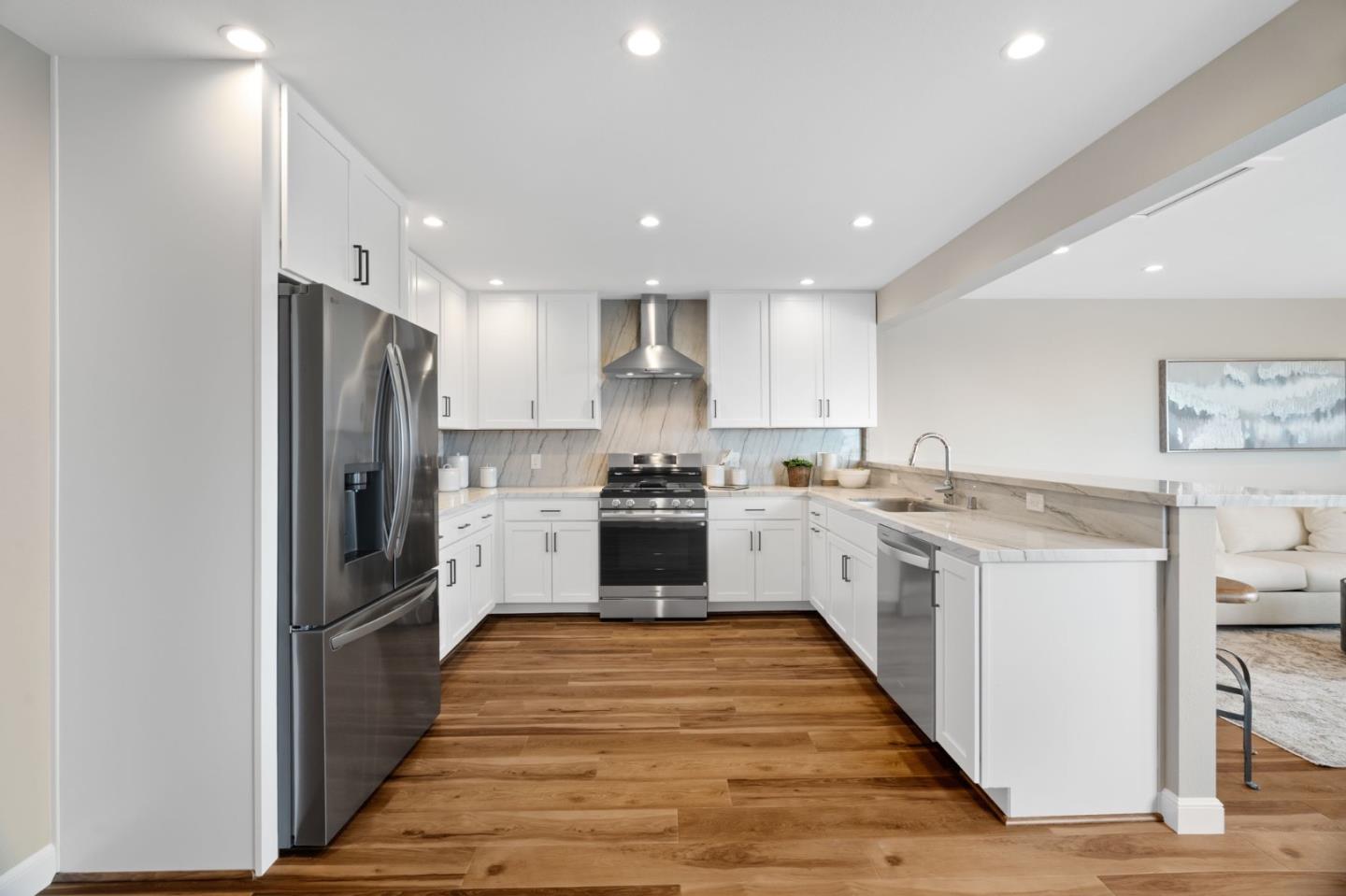 3901 Coronado Way San Bruno, CA 94066 - Photo 7 of 31 a kitchen with stainless steel appliances granite countertop a refrigerator and a stove top oven