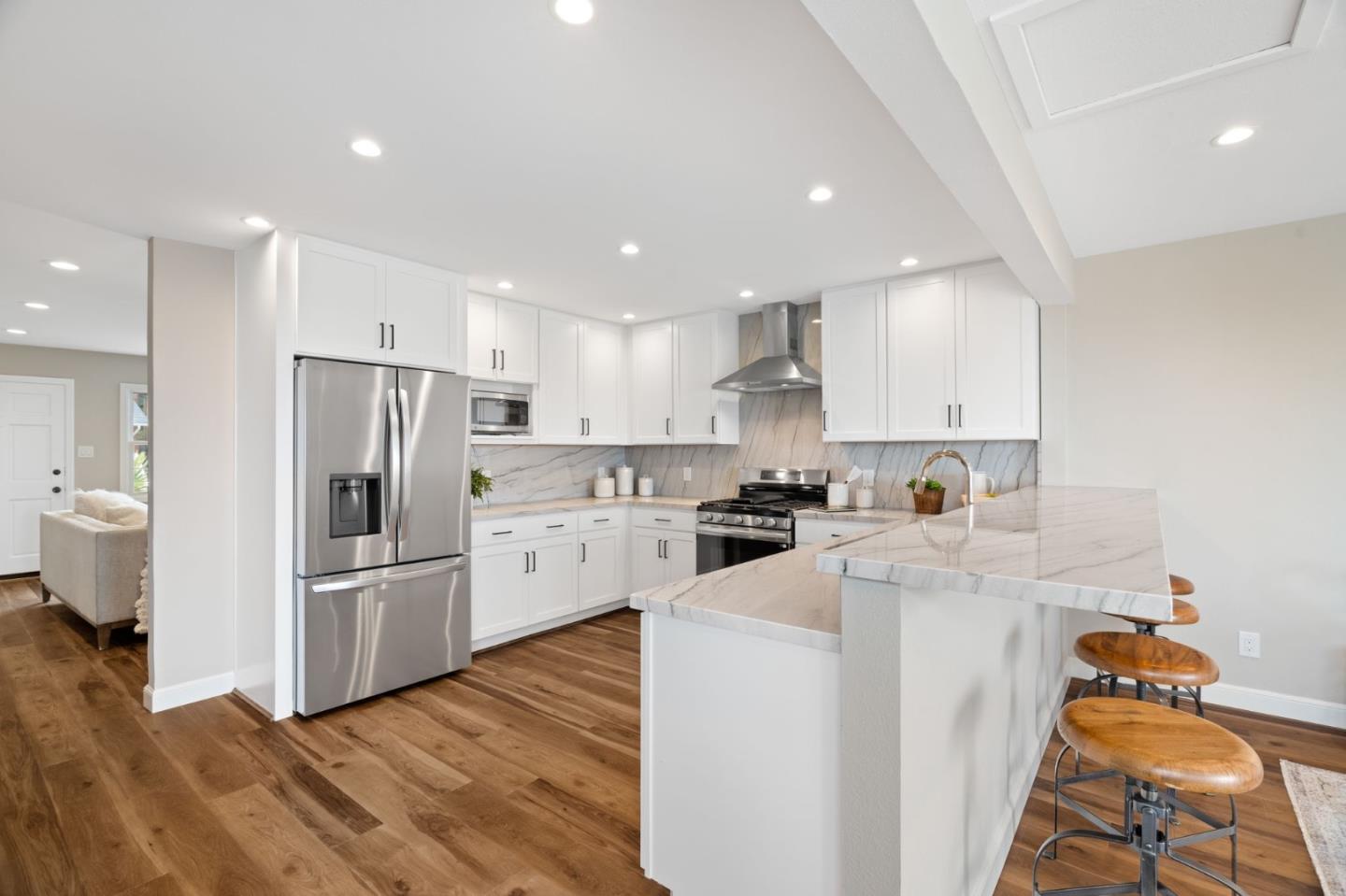 3901 Coronado Way San Bruno, CA 94066 - Photo 8 of 31 a kitchen with stainless steel appliances a refrigerator sink and cabinets