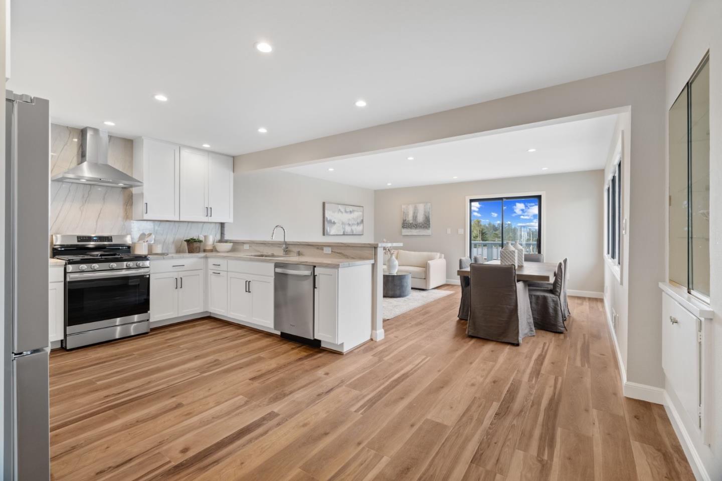 3901 Coronado Way San Bruno, CA 94066 - Photo 9 of 31 a kitchen with white cabinets and stainless steel appliances