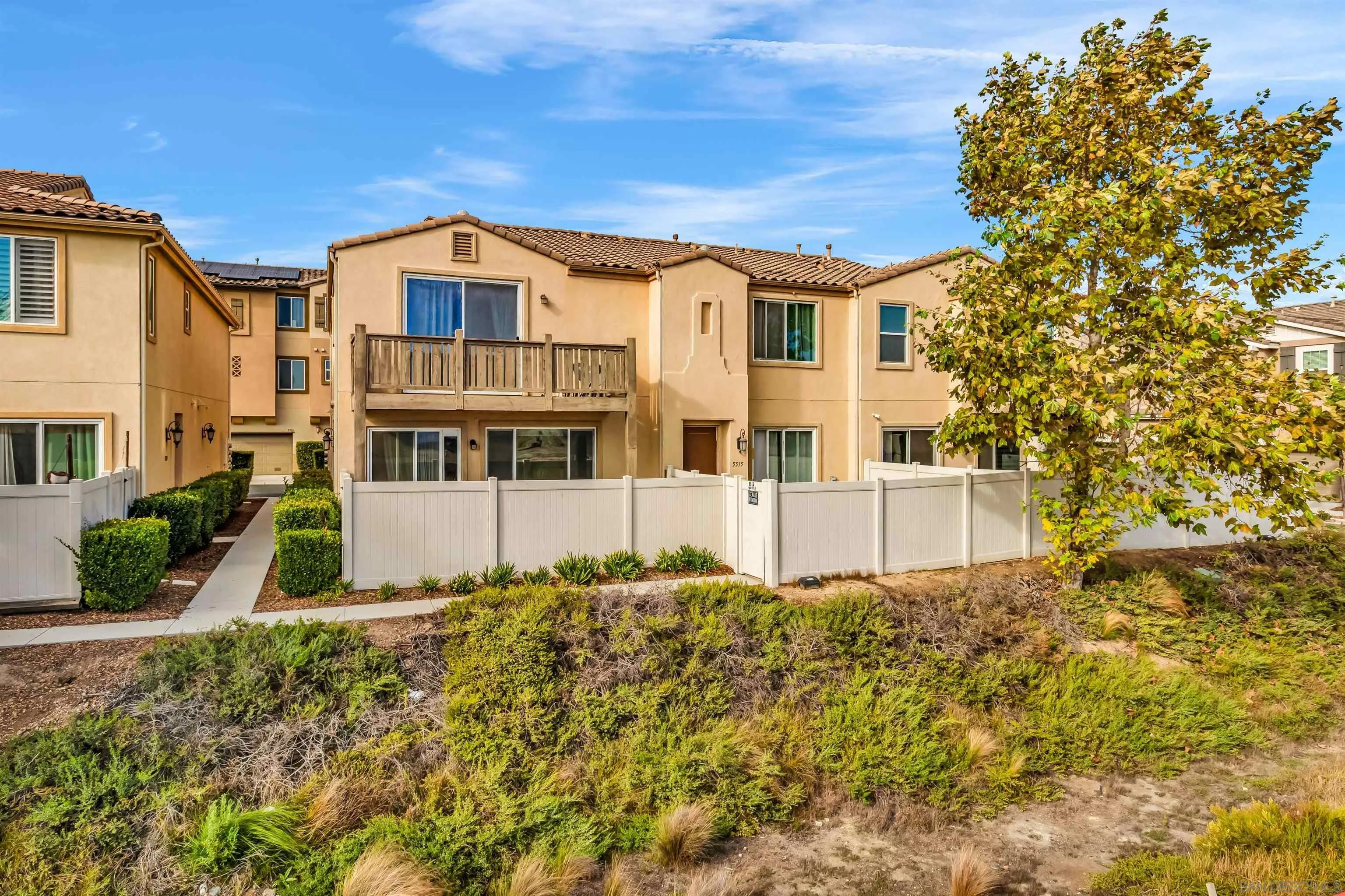 5515 San Roberto San Diego, CA 92154 - Photo 1 of 27 a view of a white house with a yard