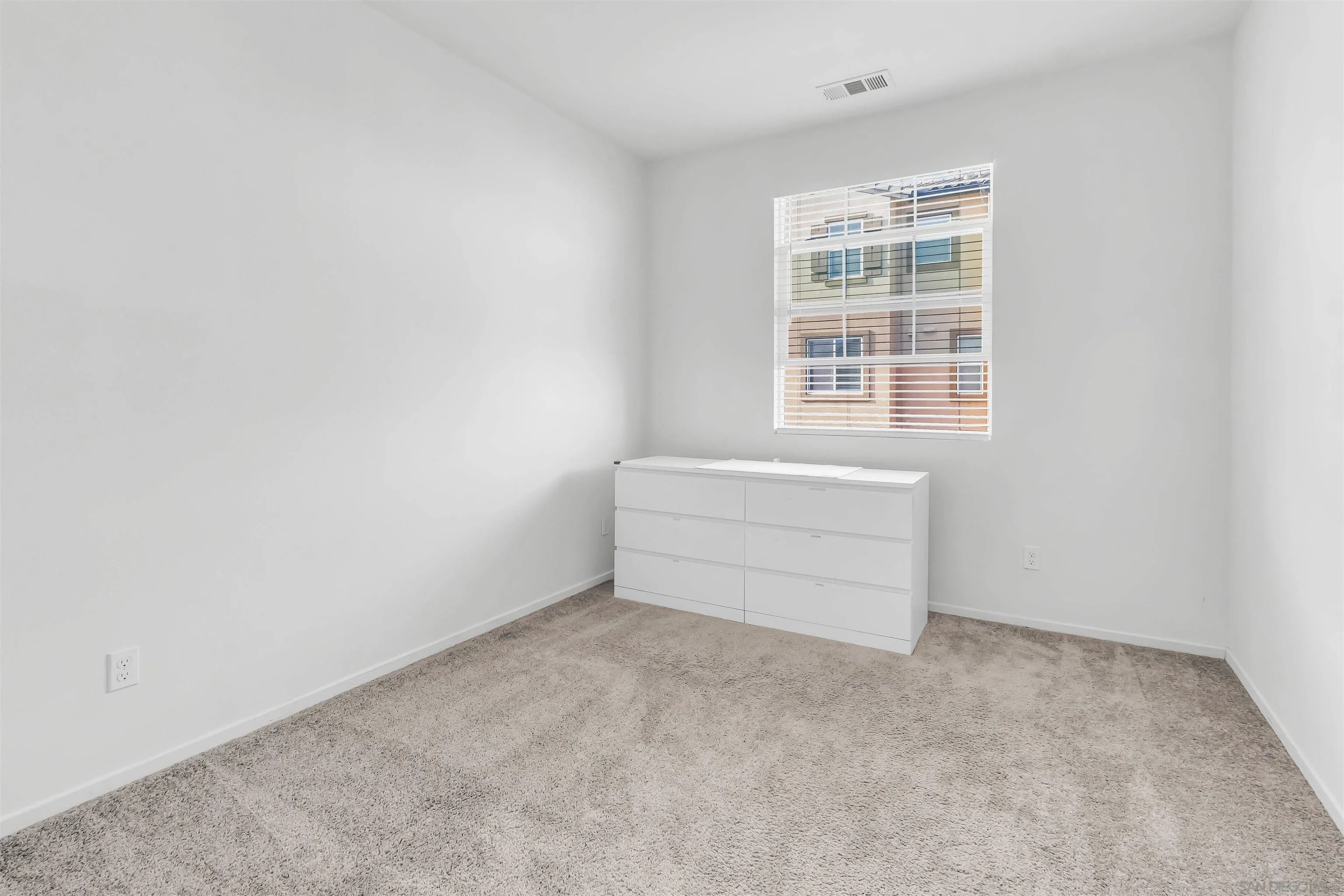 5515 San Roberto San Diego, CA 92154 - Photo 13 of 27 an empty room with a window