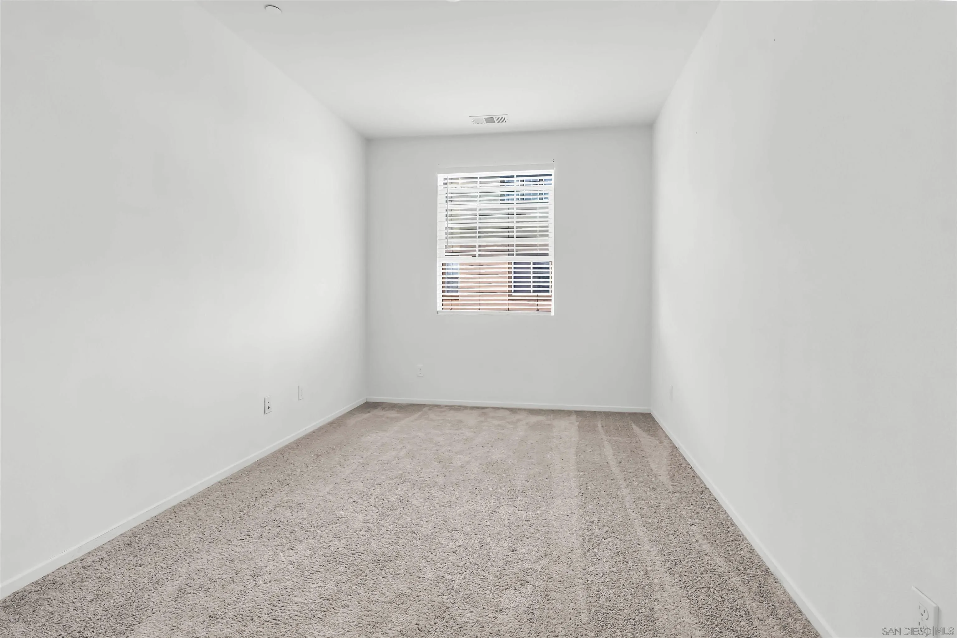 5515 San Roberto San Diego, CA 92154 - Photo 17 of 27 an empty room with a window