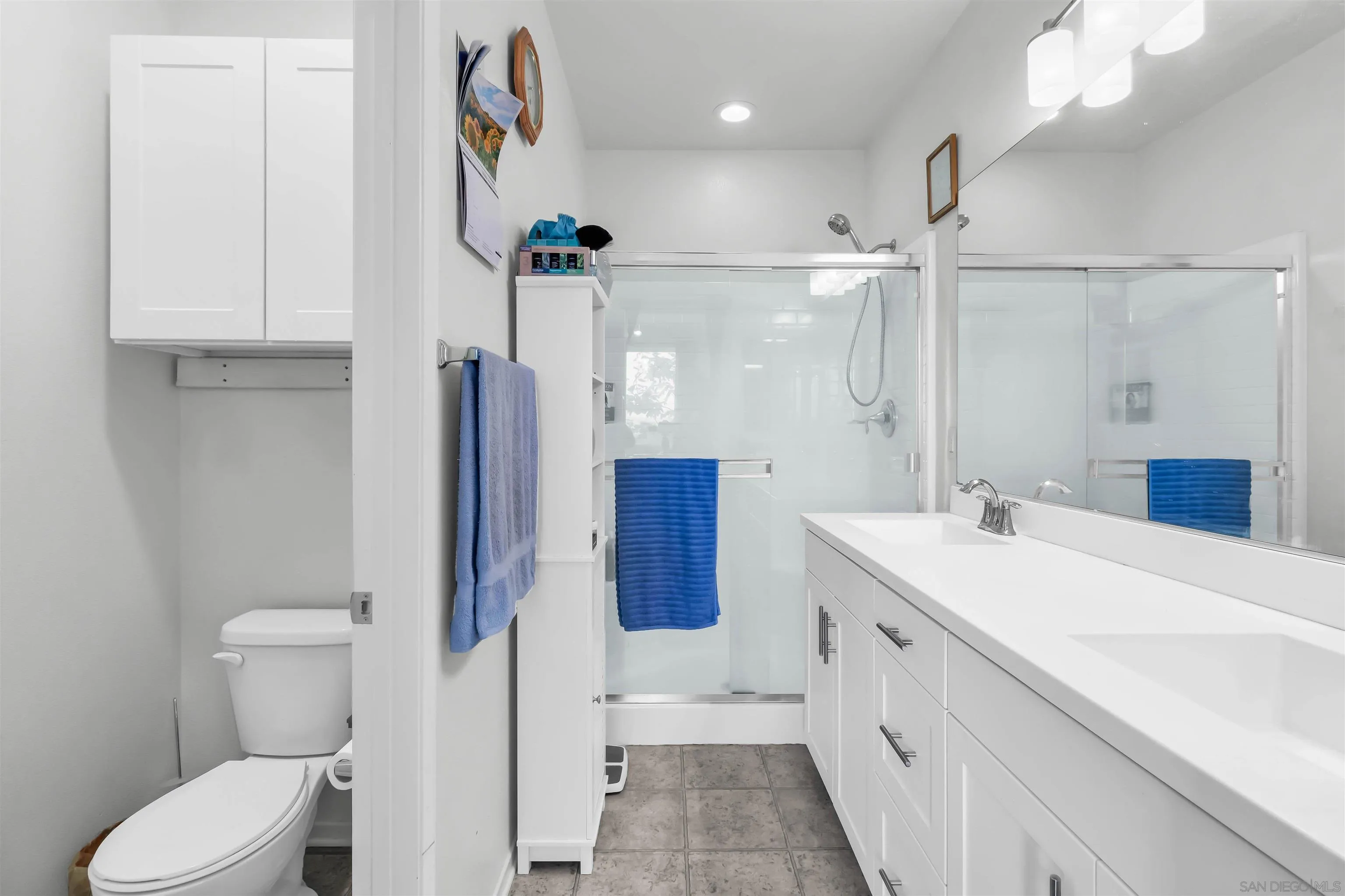 5515 San Roberto San Diego, CA 92154 - Photo 22 of 27 a bathroom with a sink a toilet and shower