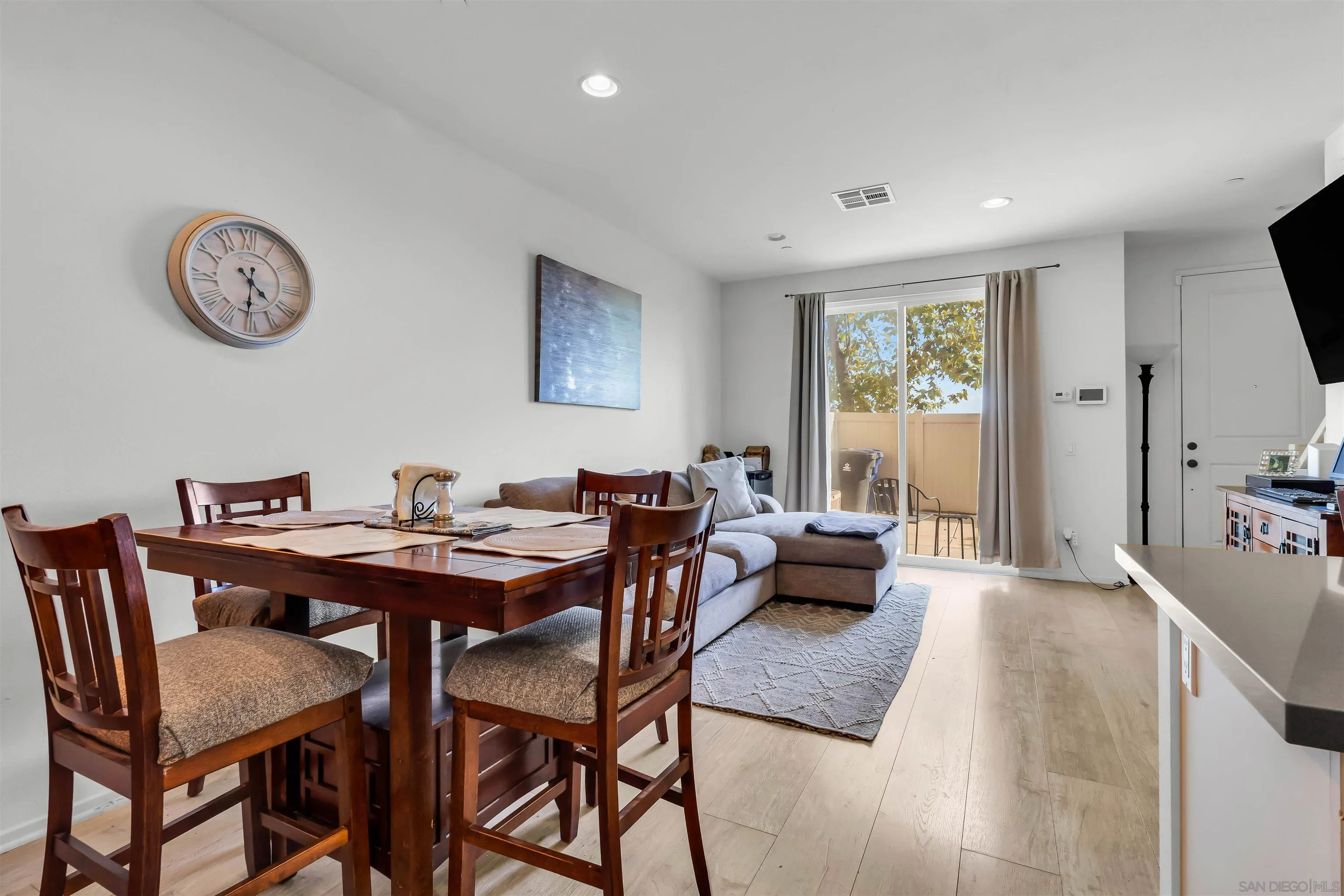 5515 San Roberto San Diego, CA 92154 - Photo 9 of 27 a view of a dining room with furniture and a large window