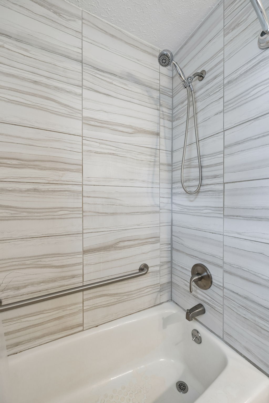 1326 Shahan Road Pleasant View, TN 37146 - Photo 18 of 41 a bathroom with a tub and a shower