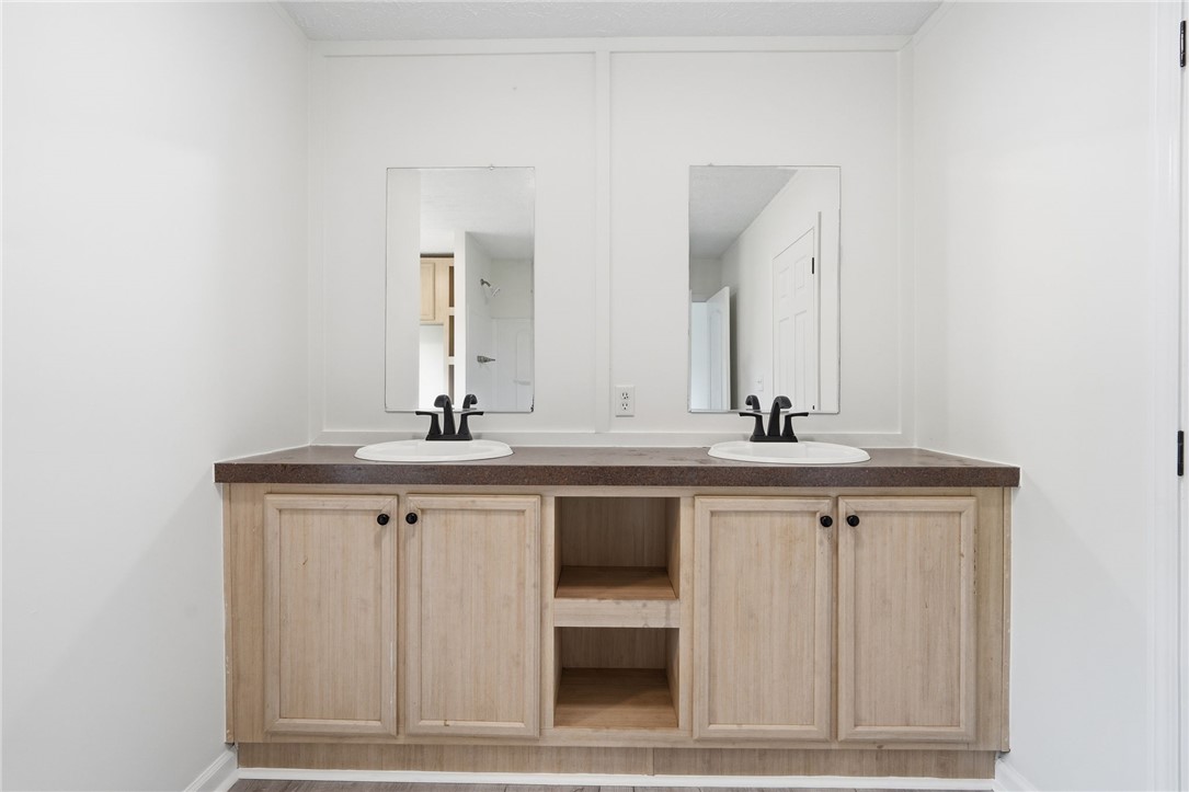 112 Sir Francis Drake Way Liberty, SC 29657 - Photo 42 of 42 This bright bathroom features a spacious double vanity, offering both convenience and ample storage.
