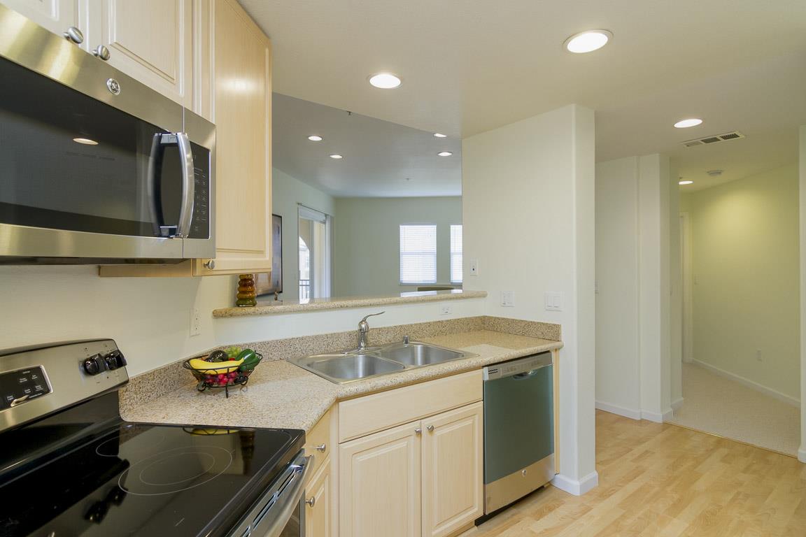 1883 Agnew Road, Unit 428 Santa Clara, CA 95054 - Photo 3 of 8 a kitchen that has a sink a stove and cabinets