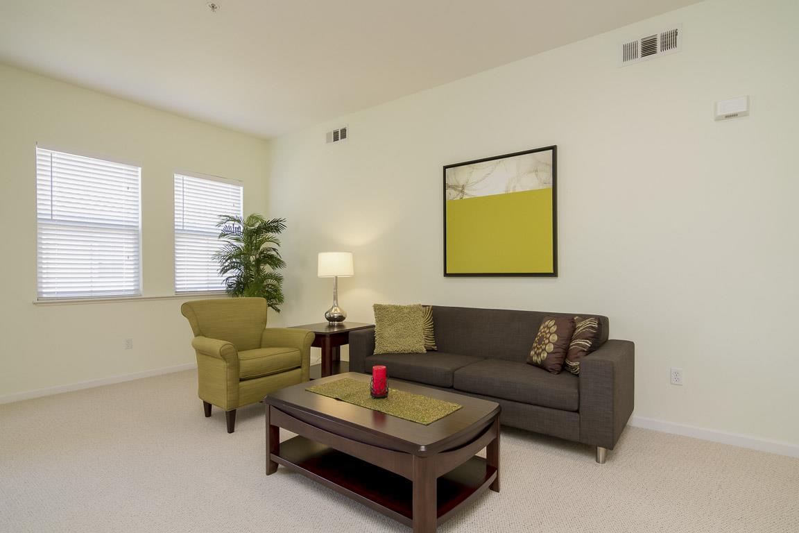 1883 Agnew Road, Unit 428 Santa Clara, CA 95054 - Photo 5 of 8 a living room with furniture and a potted plant
