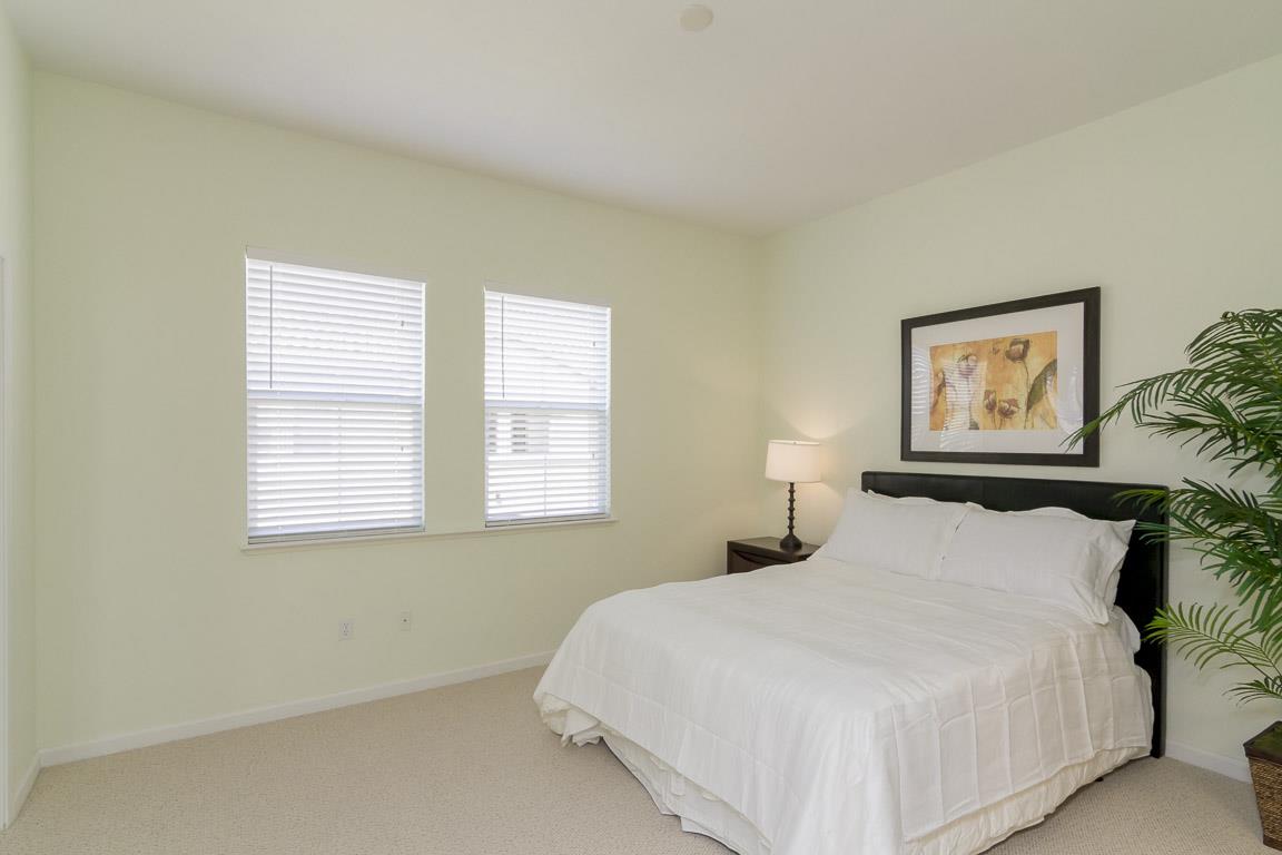 1883 Agnew Road, Unit 428 Santa Clara, CA 95054 - Photo 6 of 8 a bedroom with a bed and painting on the wall