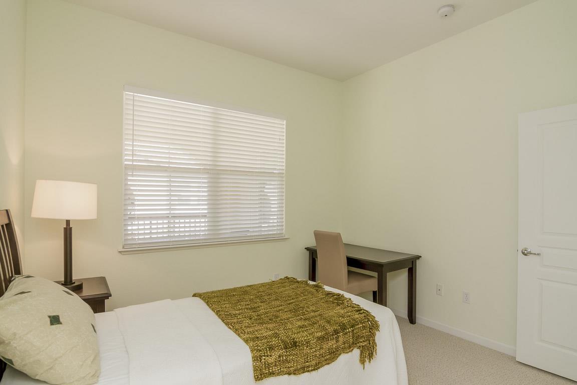 1883 Agnew Road, Unit 428 Santa Clara, CA 95054 - Photo 7 of 8 a bedroom with a bed and a window