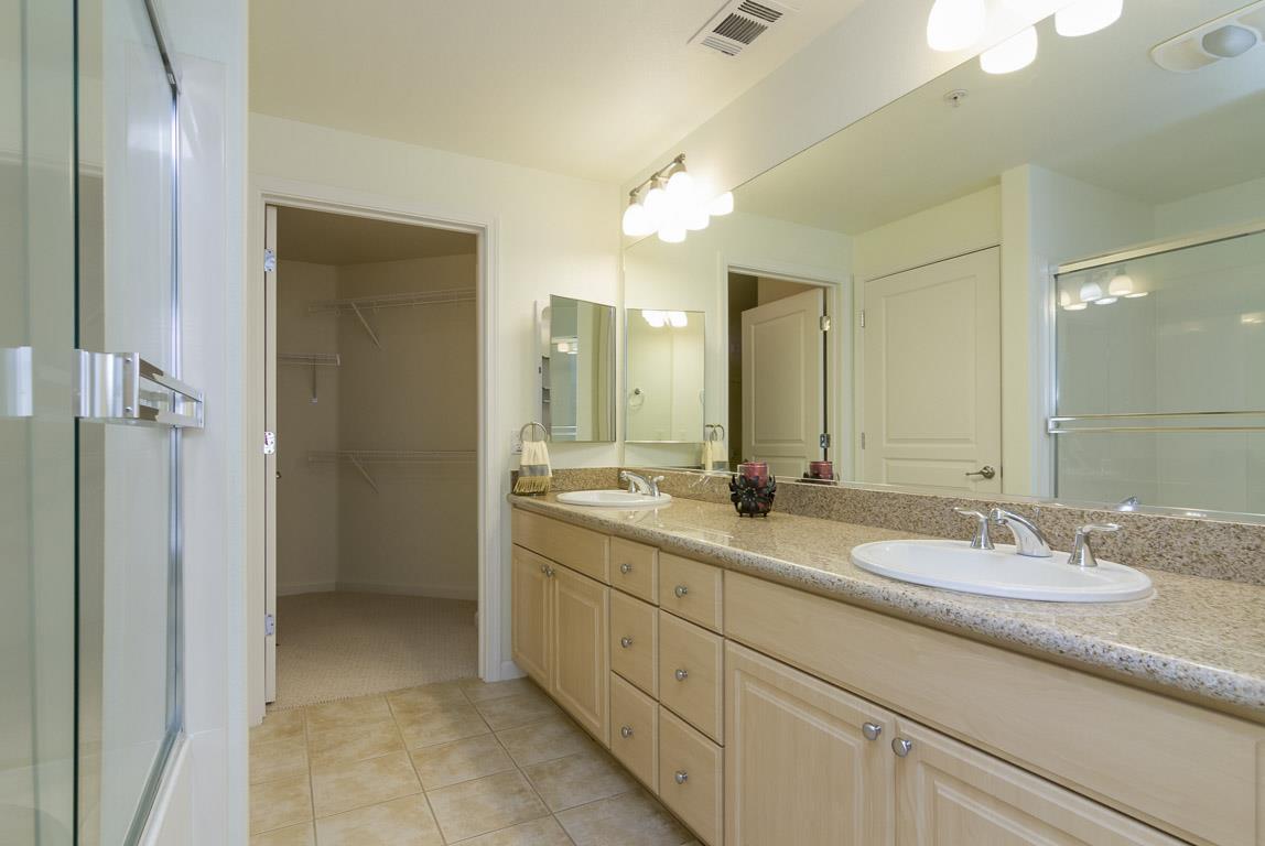 1883 Agnew Road, Unit 428 Santa Clara, CA 95054 - Photo 8 of 8 a bathroom with a double vanity sink mirror and double