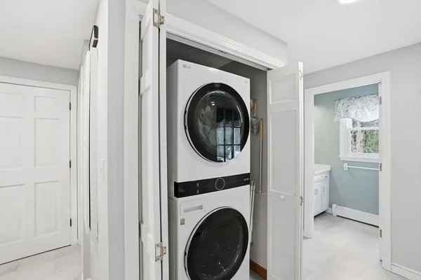 a view of a hallway with washer and dryer