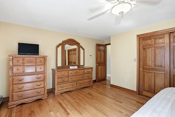 a view of room with wooden floor