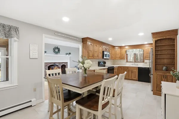 a dining room with furniture and window