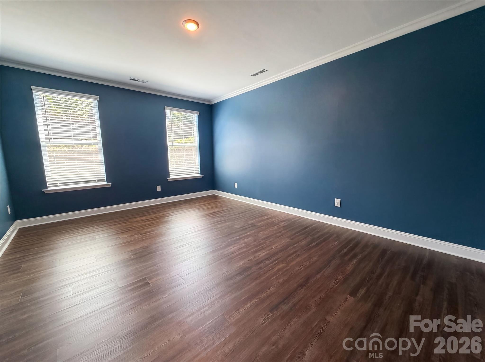 1321 Fishing Creek Road Clover, SC 29710 - Photo 4 of 19 a view of an empty room with wooden floor and a window
