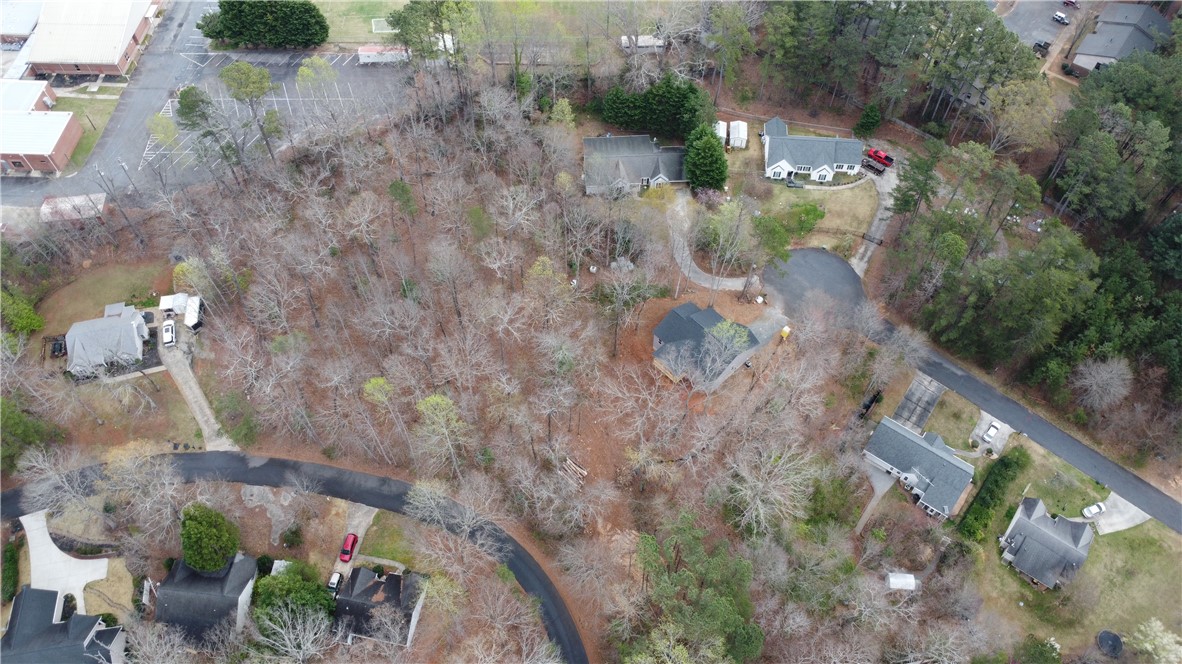 Lot 30-31 Den Ridge Drive Walhalla, SC 29691 - Photo 3 of 4 An aerial view showcases a residential area with homes nestled among mature trees and winding roads.