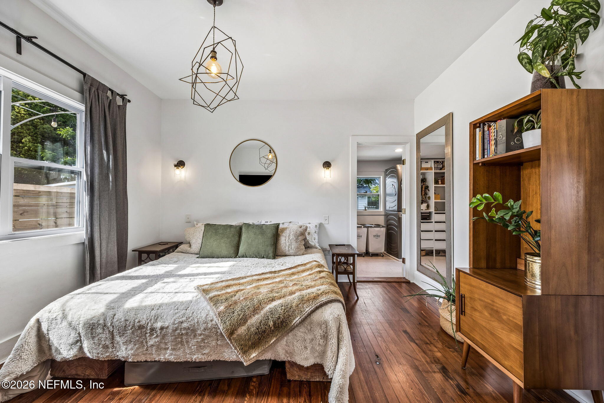 4713 French Street Jacksonville, FL 32205 - Photo 26 of 74 a bedroom with a bed and a chandelier