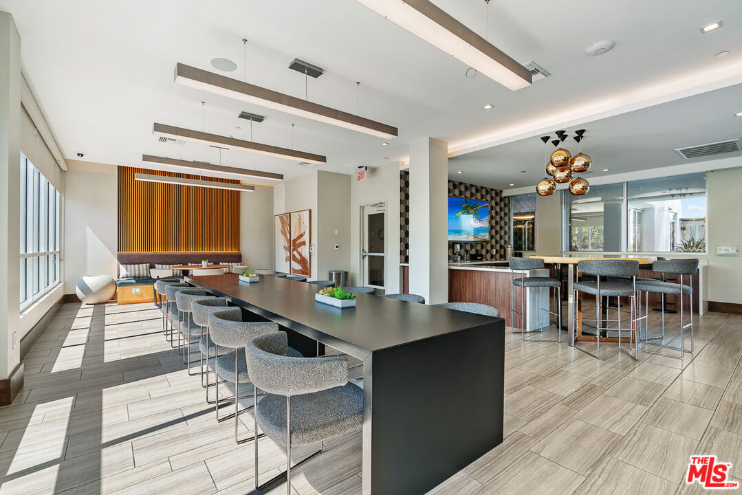 10601 Washington Boulevard, Unit 232 Culver City, CA 90232 - Photo 22 of 30 a view of a dining room with furniture and wooden floor