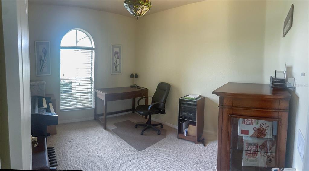 7243 Bahama Swallow Avenue Weeki Wachee, FL 34613 - Photo 11 of 18 a workspace with furniture and a window