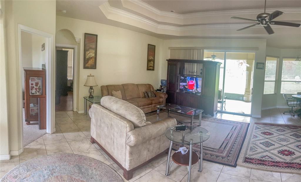 7243 Bahama Swallow Avenue Weeki Wachee, FL 34613 - Photo 3 of 18 a living room with furniture and a fireplace