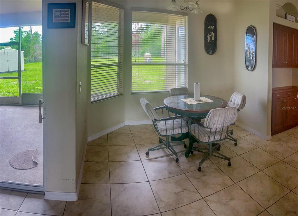 7243 Bahama Swallow Avenue Weeki Wachee, FL 34613 - Photo 4 of 18 a view of a dining room with furniture and a window
