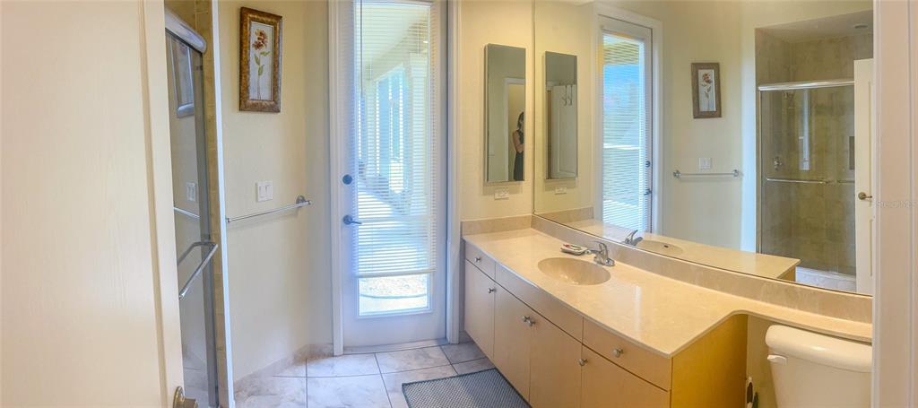 7243 Bahama Swallow Avenue Weeki Wachee, FL 34613 - Photo 8 of 18 a bathroom with a tub sink and mirror