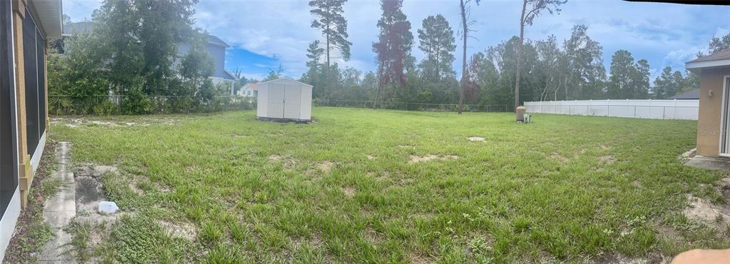 7243 Bahama Swallow Avenue Weeki Wachee, FL 34613 - Photo 10 of 18 a view of a tiny house with a yard