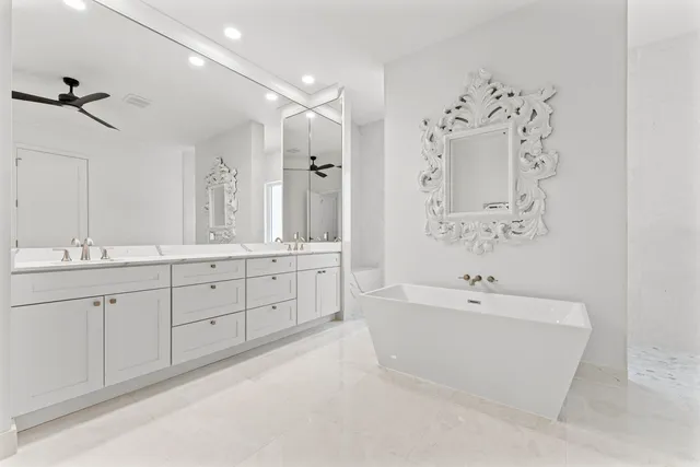 a utility room with sink dryer and washer
