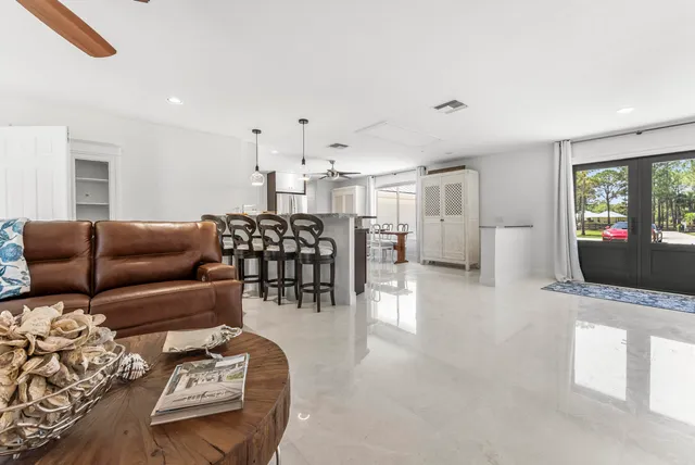 a view of a house with a yard porch and sitting area