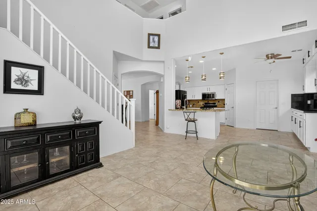a view of entryway with furniture and front door