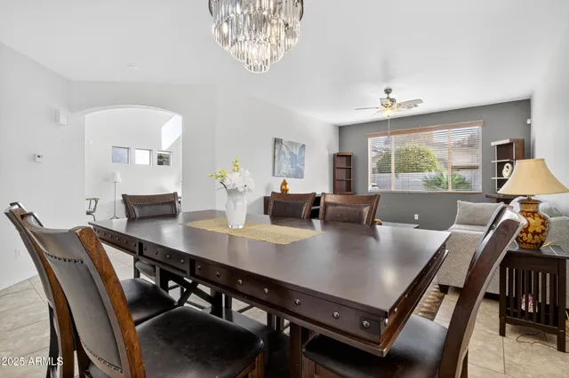 a kitchen with granite countertop a sink a stove and cabinets