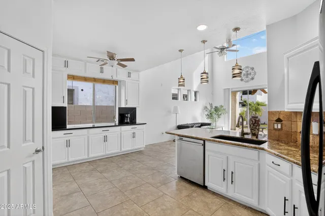 a kitchen with a refrigerator stove and sink