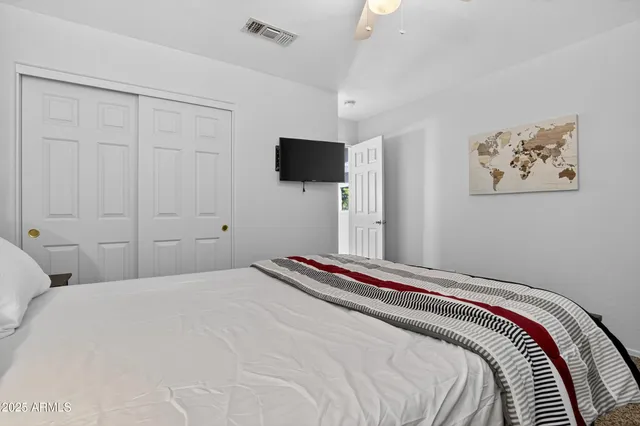 a spacious bathroom with a double vanity sink and a mirror