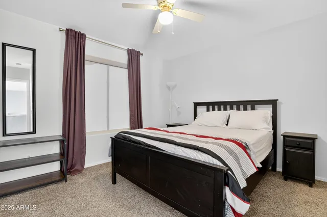 a bathroom with a glass shower door and a sink