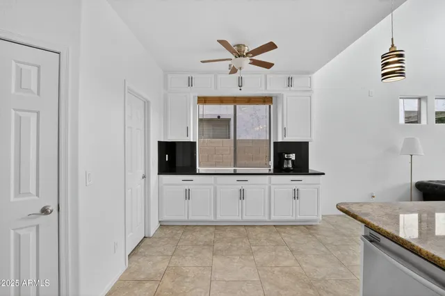 a bathroom with a sink toilet and a mirror