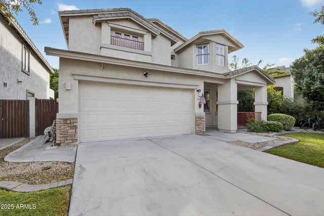 a view of a white house with a outdoor space