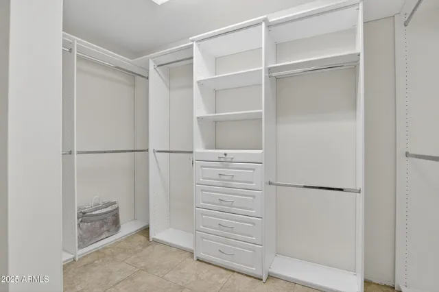 a view of a livingroom with furniture and a ceiling fan