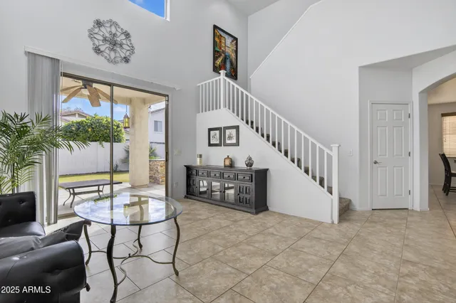 a living room with furniture and kitchen view