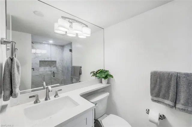 a view of a porch with furniture and garden