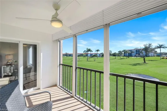 a view of outdoor space with green field and trees