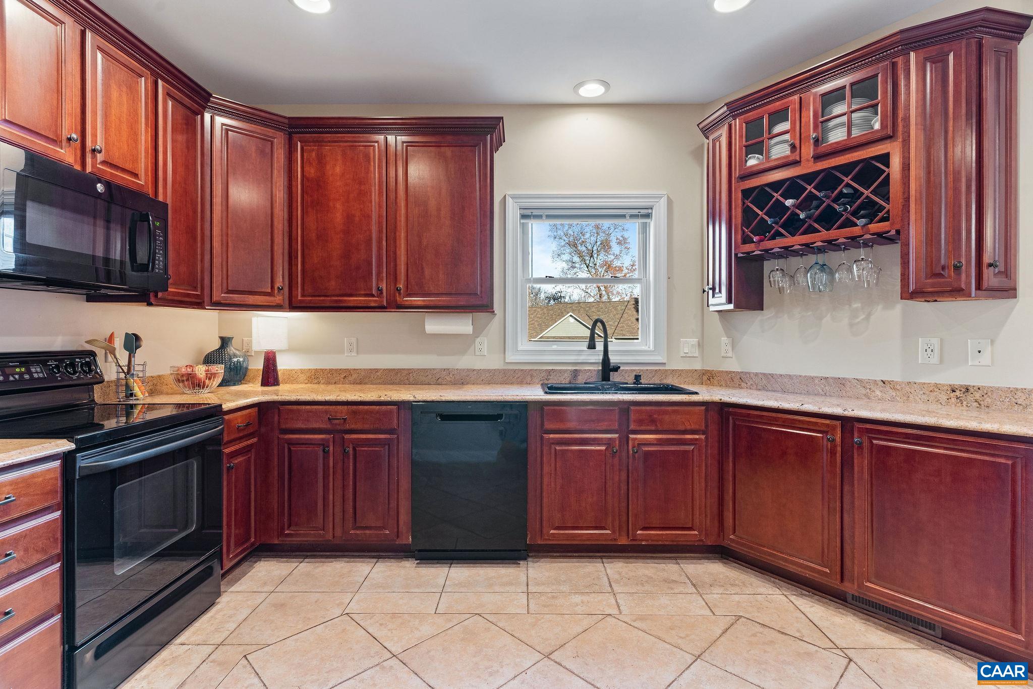 1286 Chatham Ridge Charlottesville, VA 22901 - Photo 15 of 33 a kitchen with stainless steel appliances granite countertop a sink stove and cabinets