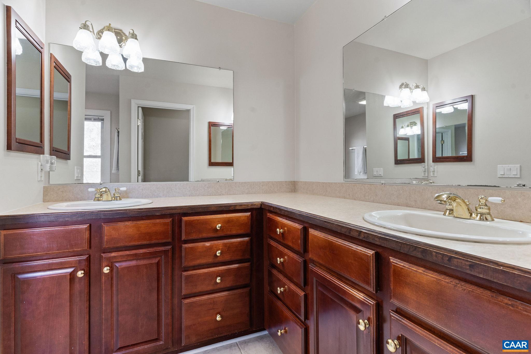 1286 Chatham Ridge Charlottesville, VA 22901 - Photo 31 of 33 a bathroom with a granite countertop sink and a mirror