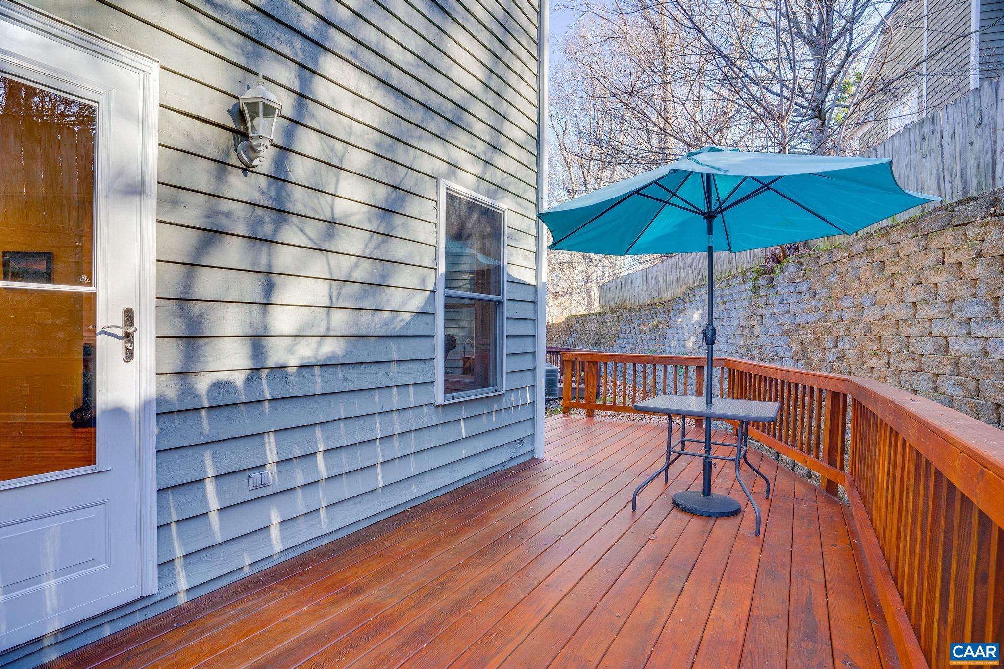 1286 Chatham Ridge Charlottesville, VA 22901 - Photo 32 of 33 a balcony with table and chairs