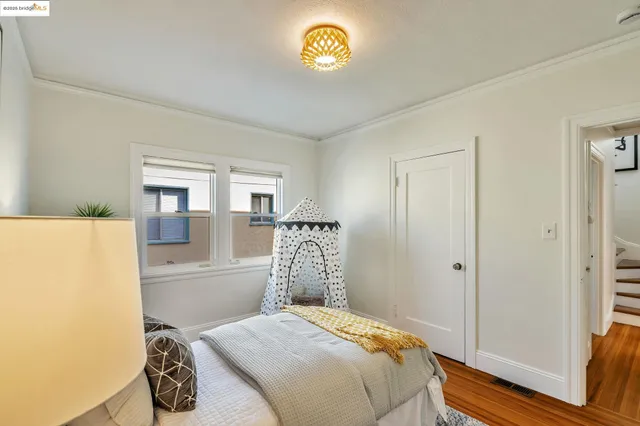 a bedroom with a bed and a table in it