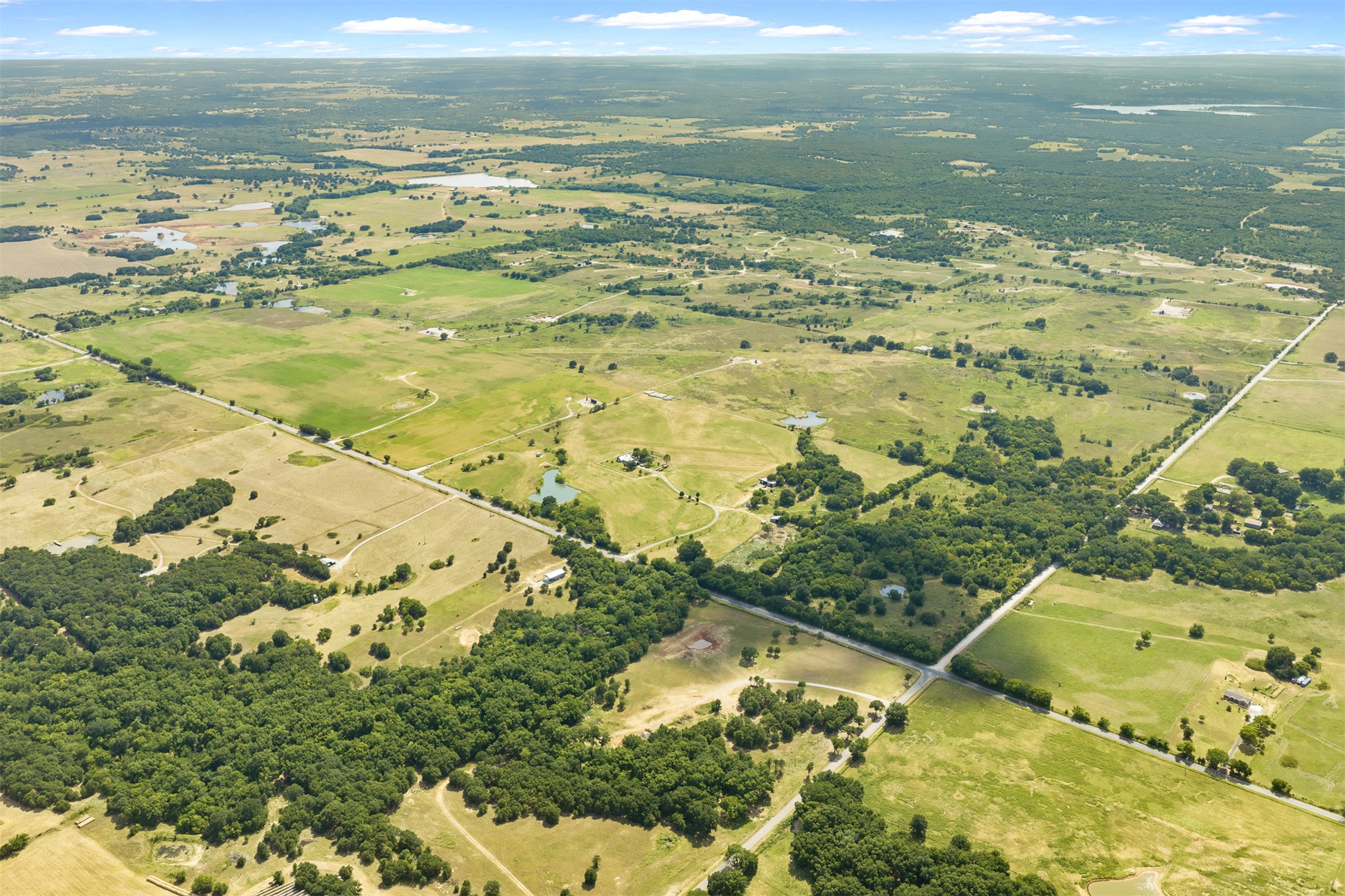4 Keller Road Wilson, OK 73463 - Photo 4 of 32 Expansive aerial view showcasing diverse land features
