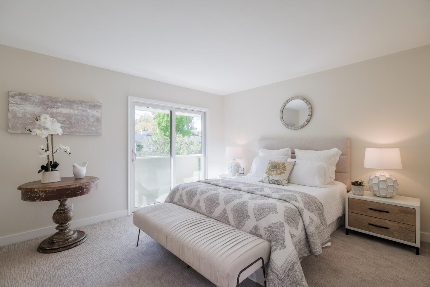 2313 Sharon Road Menlo Park, CA 94025 - Photo 17 of 29 a bedroom with a bed and a chandelier